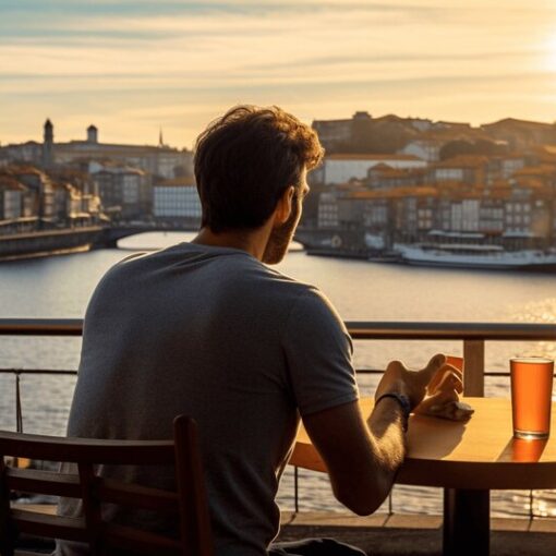 Solo diner at a Porto cafe table with food and a drink